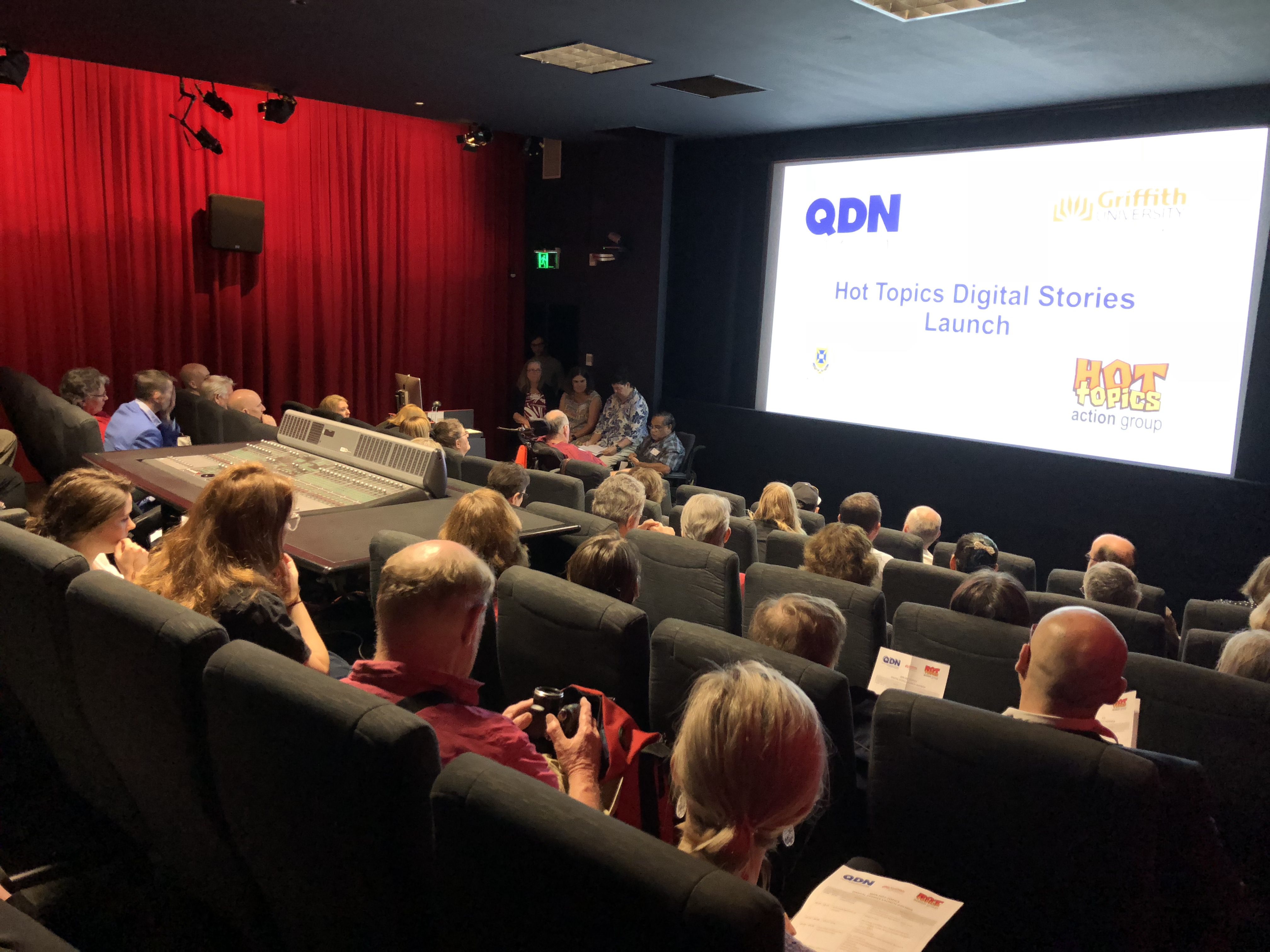 QDN Hot Topics Digital Stories launch - people sitting in large room watching presentation