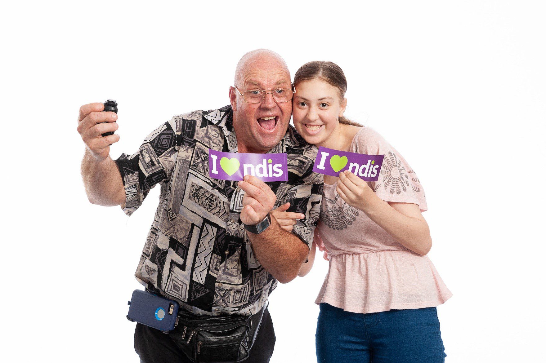 QDN members holding I love the NDIS stickers