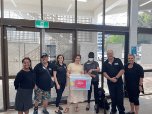 Pictured local participants at a recent workshop on the Gold Coast. Seven people are pictured, and one person is holding up an emergency kit.