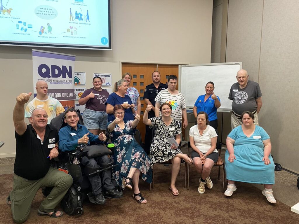 QDN members and attendees of the P-CEP workshop standing for a group photo.