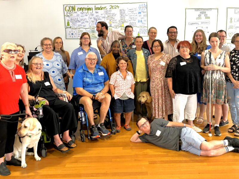 The image show a group photo of 22 people smalling at the camera during the second emerging leaders workshop.