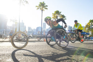 a woman in a racing wheelchair
