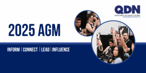 2025 AGM Banner. A dark blue block splits half the banner horizontally. There are two images of members from last years AGM in circle shaped frames. QDN logo in the top corner.