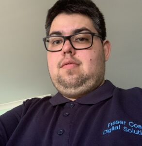 Picture of a man with dark brown hair wearing glasses.