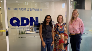 3 women standing next to a QDN logo
